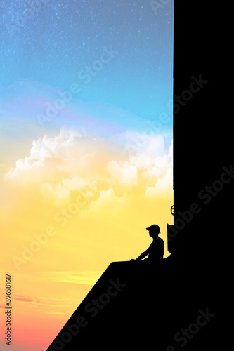 Silhouette of a person wearing a hat in front of galaxy background looking like leading