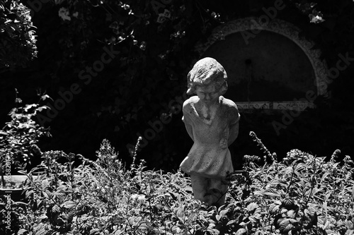 creepy child statue in the garden