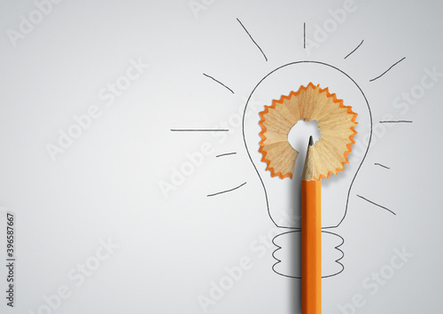 Idea, minimal concept. Pencil with shavings light bulb shape. Copy space