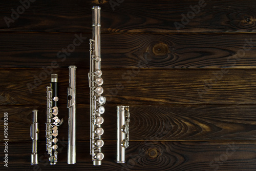 flute parts laid out on a wooden surface