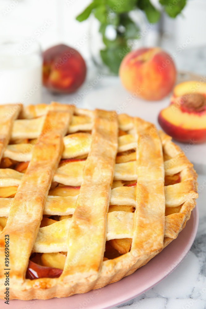 Delicious peach pie on white marble table, closeup Delicious peach pie on white marble table, closeup