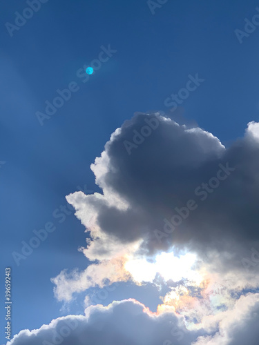 sun and moon in blue sky with clouds  fhuy1