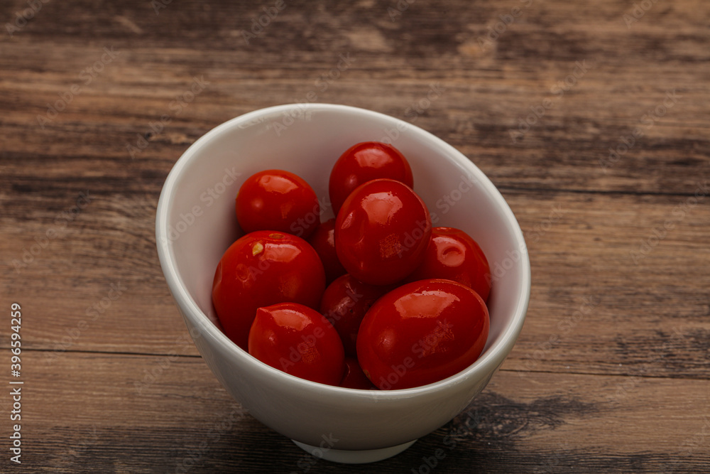 Pickled cherry tomatoes in the bowl Pickled cherry tomatoes in the bowl