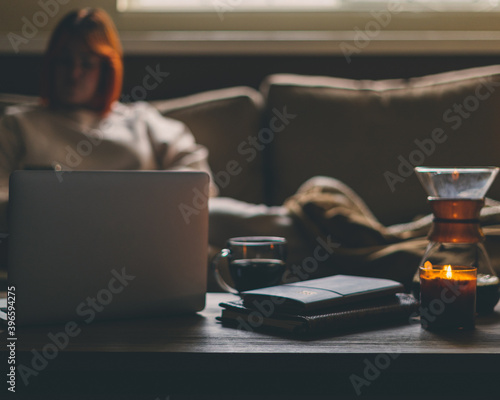 person working from home on laptop photo