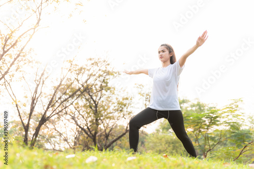 young women has an stretching exercises outdoors at park