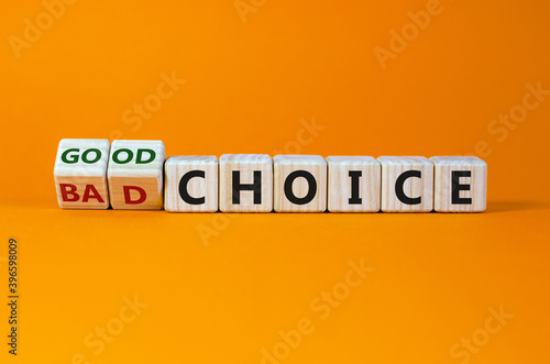 Good or bad choice symbol. Turned cubes and changed the words 'bad choice' to 'good choice'. Beautiful orange background. Business and good choice concept. Copy space.