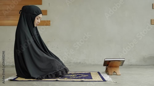 Side view video of Two young Muslim women are performing prayers. Islamic religion,part 2
 photo