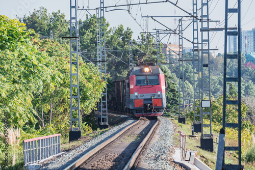 Freight train moves along Black sea coast. Sochi.