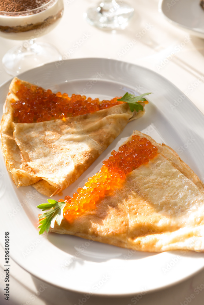 Pancakes served with red caviar Pancakes served with red caviar