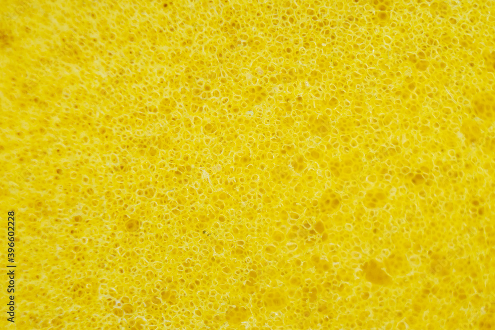 Yellow porous soft sponge background Yellow porous soft sponge background