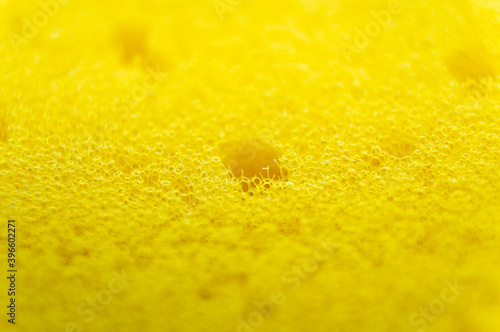 Yellow porous soft sponge background