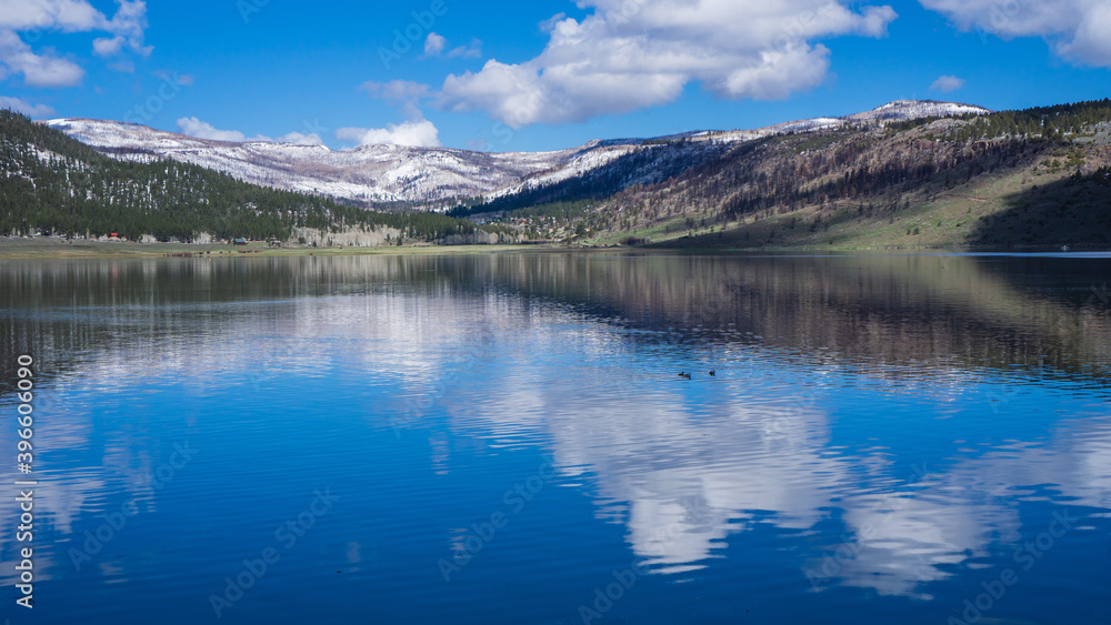 Panguitch lake in Utah, reflection of snowy mountains on the lake