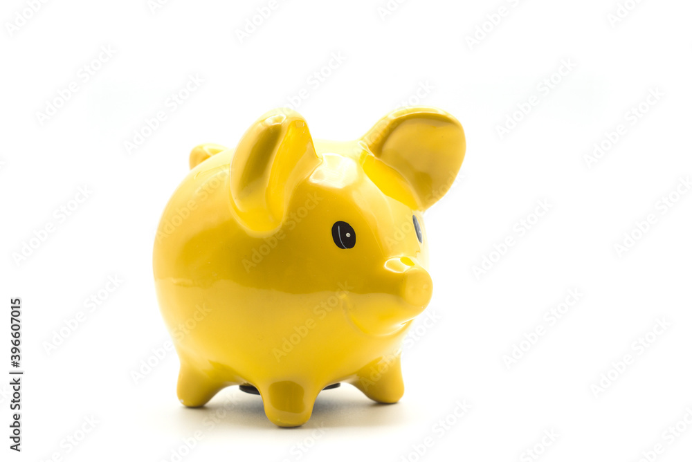 Closeup of yellow piggy bank on white background Closeup of yellow piggy bank on white background