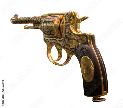   Golden revolver of the Nagan system-The first weapons factory in Tula, 1928. Isolated on white photo