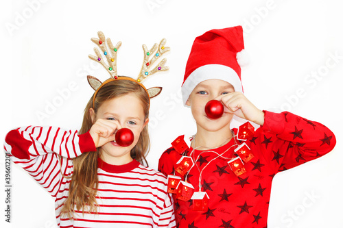 Santa and his deer, beautiful girl red sweater Christmas and New Year's gift. Happy little girl and boy in Santa hat have Christmas. on white background banner, christmas and concept happy kids