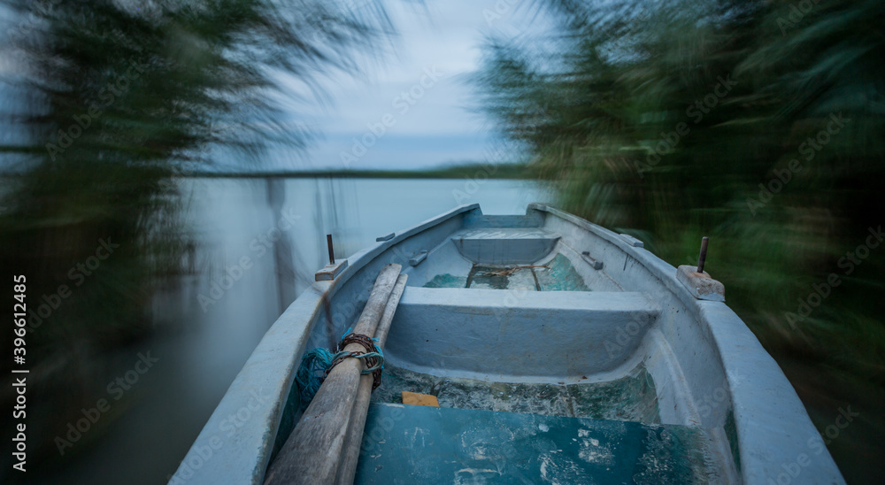 Long exposure shot of an fiberglass boat - Sulina, Romania Long exposure shot of an fiberglass boat - Sulina, Romania
