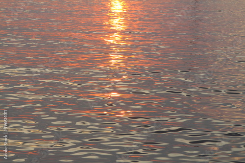 orange sunset on the sea  the setting sun is reflected in the water.