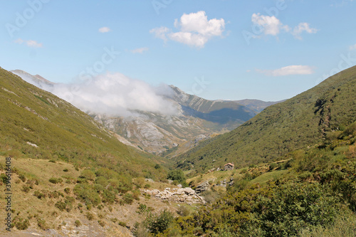 Low clouds penetrate the peaks in the valleys of the Cantabrian Mountains late in the day in summer, northern Spain