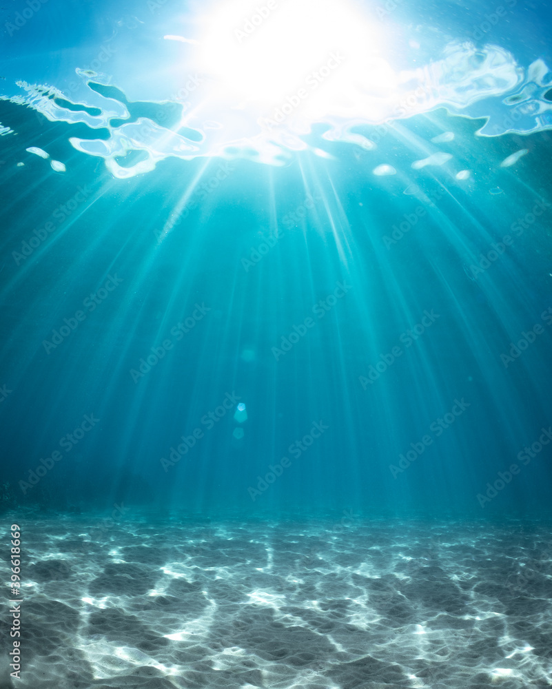 Background of sun beams through clear water