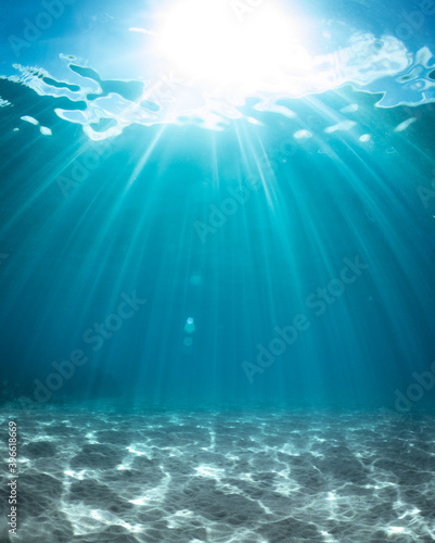 Background of sun beams through clear water