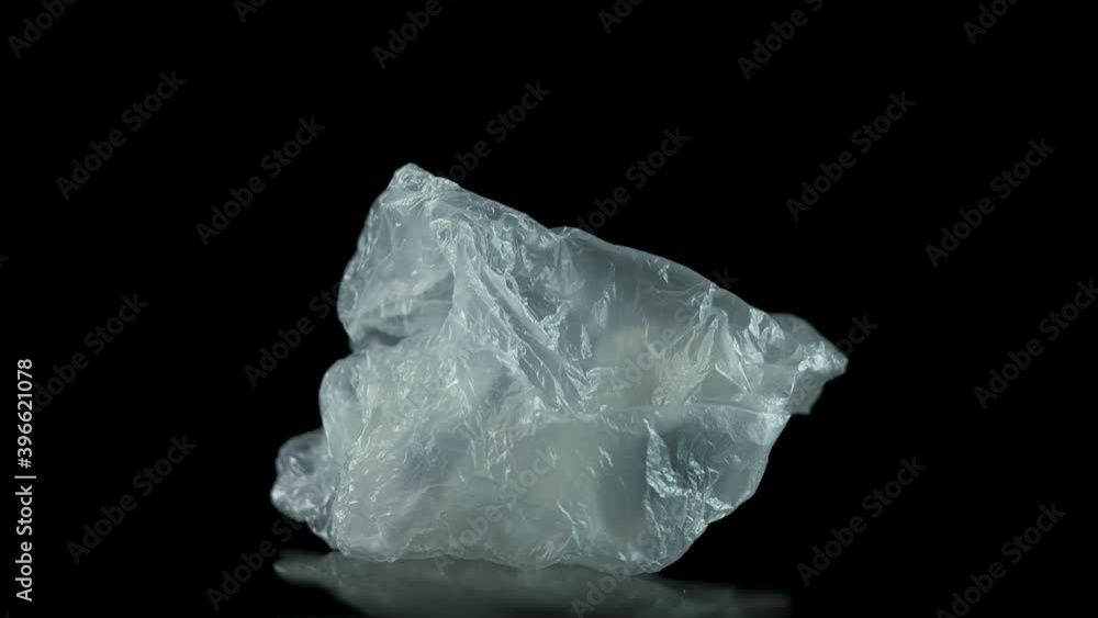 Plastic ecology view. Cellophane bag on a black background. Plastic ecology view. Cellophane bag on a black background.