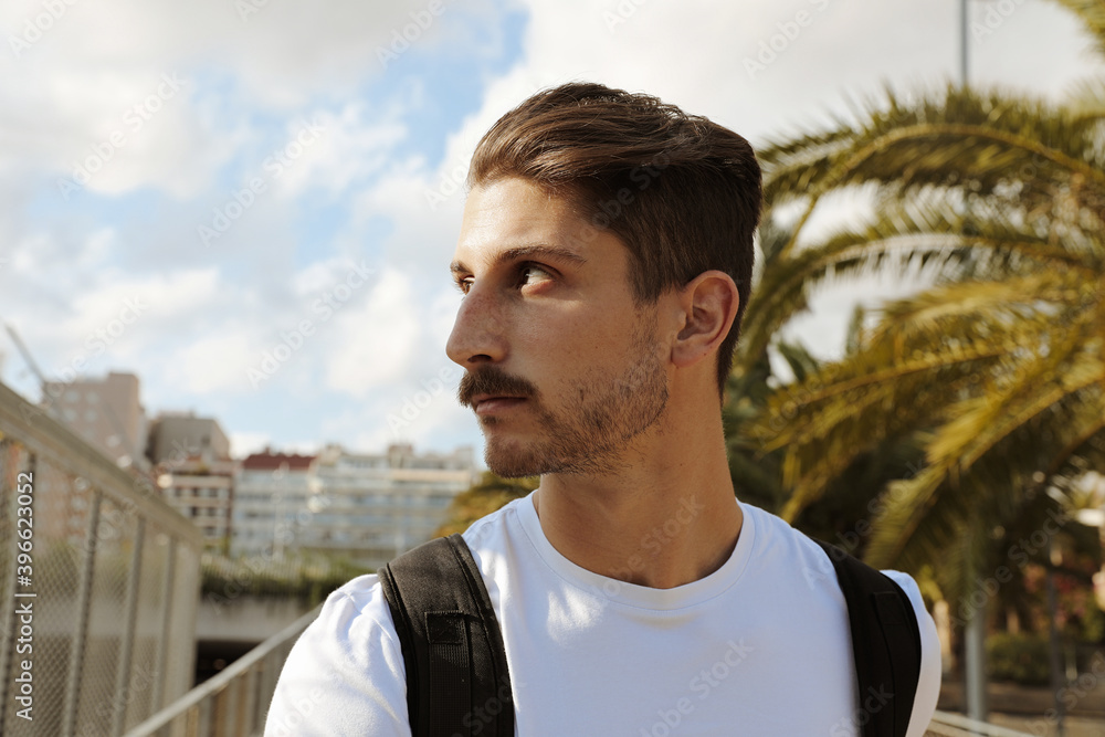 Close-up portrait of young handsome male model. Outdoor. Close-up portrait of young handsome male model. Outdoor.