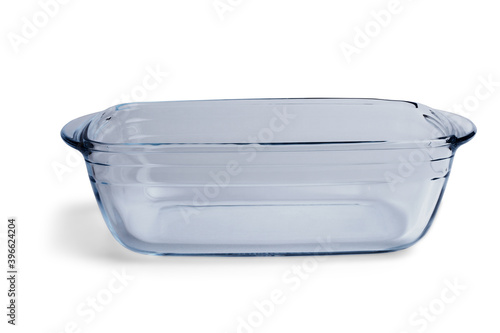 Glass baking tray on a white background with shadow, close-up