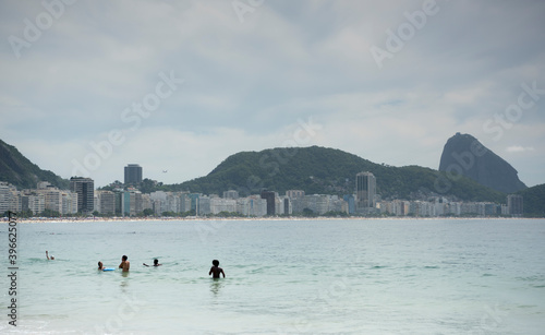 Citizens swimming in the ocean. Copacabana beach