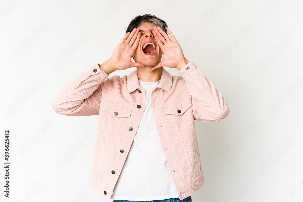 Young skinny hispanic man shouting excited to front. Young skinny hispanic man shouting excited to front.
