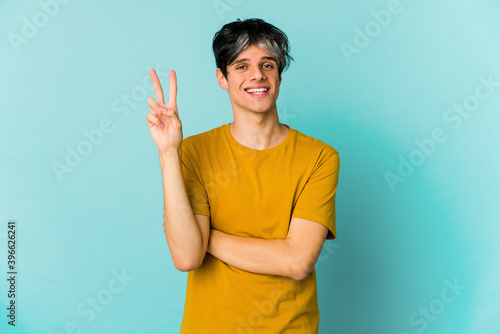 Young caucasian skinny man expressing emotions isolated on blue background