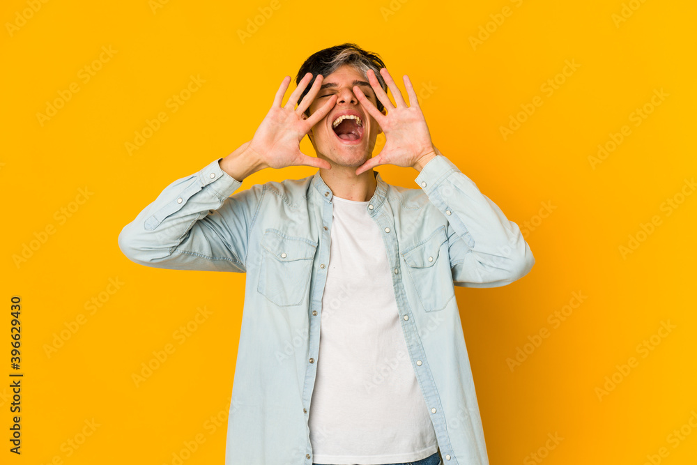 Young skinny hispanic man shouting excited to front. Young skinny hispanic man shouting excited to front.