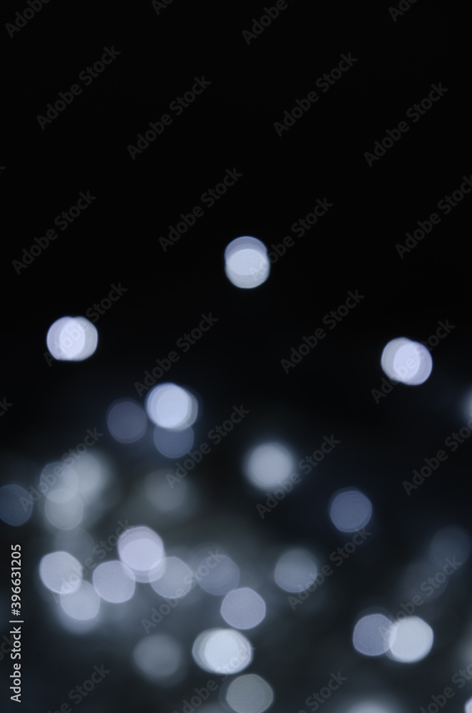 Abstract pattern of white bokeh lights on a dark background Abstract pattern of white bokeh lights on a dark background