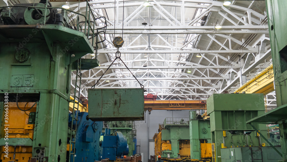 Overhead crane or bridge crane include hoist lifting for transportation, manufacturing, and production. Factory warehouse overhead crane lifts the load, Industry concept.