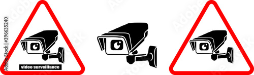Video surveillance sigh in red triangle. Warning sign set. Video surveillance is in progress icon. Black camera on white background.