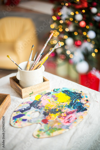 Interior artist's workshop, loft with brick walls, a palette of colors