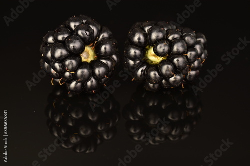 Ripe blackberries, close-up, on a black background.