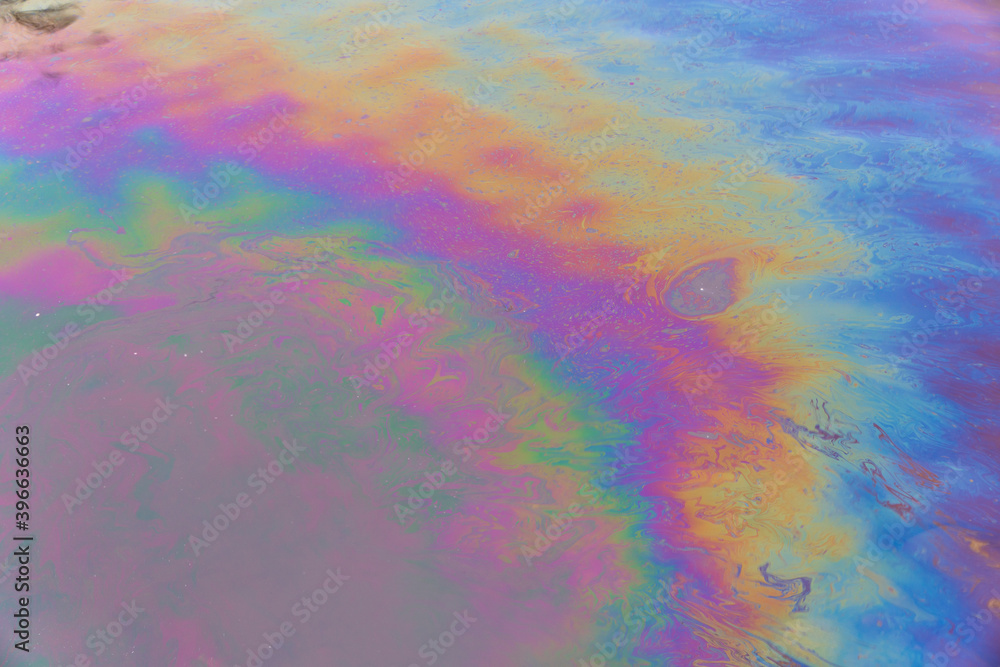 Oil petrol water pollution. Ecological disaster. Slick industry oil fuel spilling water pollution. Water surface patches of gasoline and oil. Ecological catastrophy. Concept of environmental problems