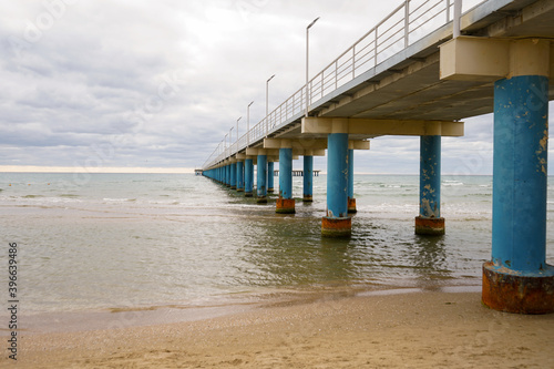 pier stretching far out to sea, seascape © Natalia Tarasova