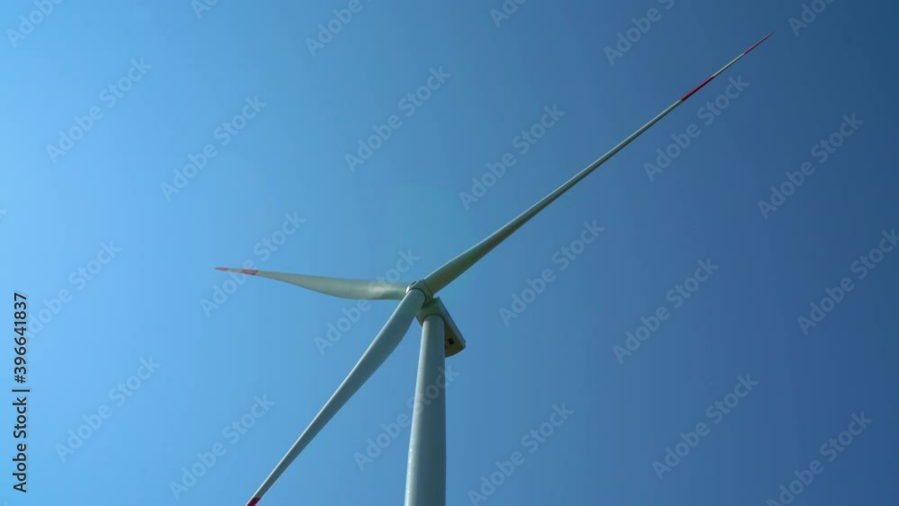 Wind turbine generating electricity on blue sky, sustainable development, renewable energy
Wind turbine generating electricity on blue sky, sustainable development, renewable energy