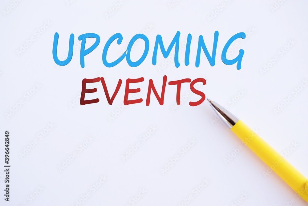 Concept Upcoming Events message on w with glasses, pencil and coffee cup on white paper , copy space Concept Upcoming Events message on w with glasses, pencil and coffee cup on white paper , copy space