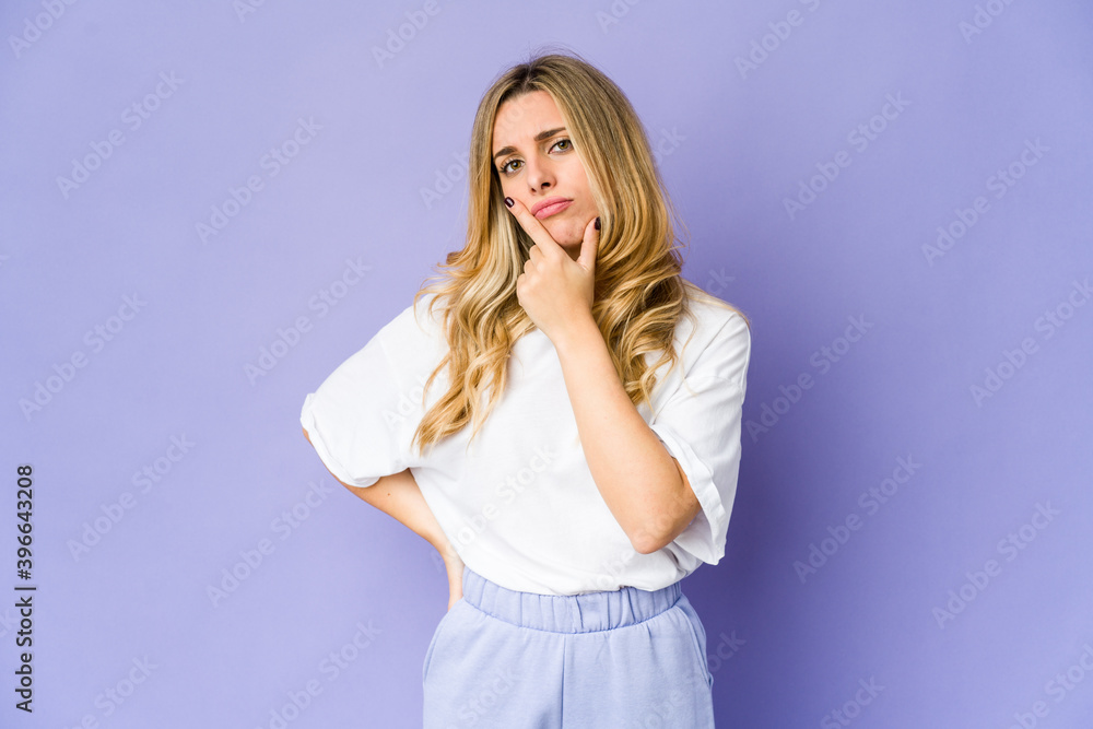 Young caucasian blonde woman contemplating, planning a strategy, thinking about the way of a business. Young caucasian blonde woman contemplating, planning a strategy, thinking about the way of a business.