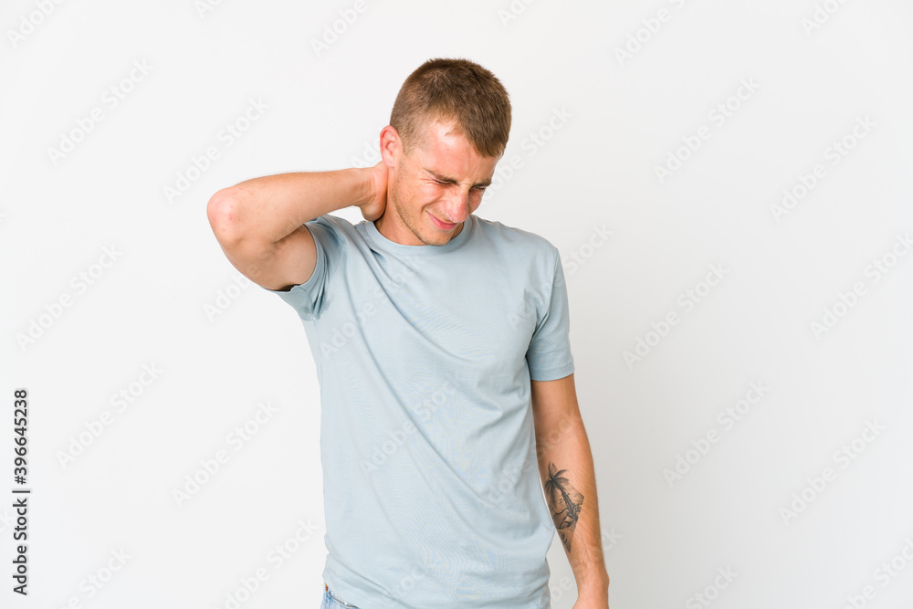 Young caucasian handsome man suffering neck pain due to sedentary lifestyle. Young caucasian handsome man suffering neck pain due to sedentary lifestyle.