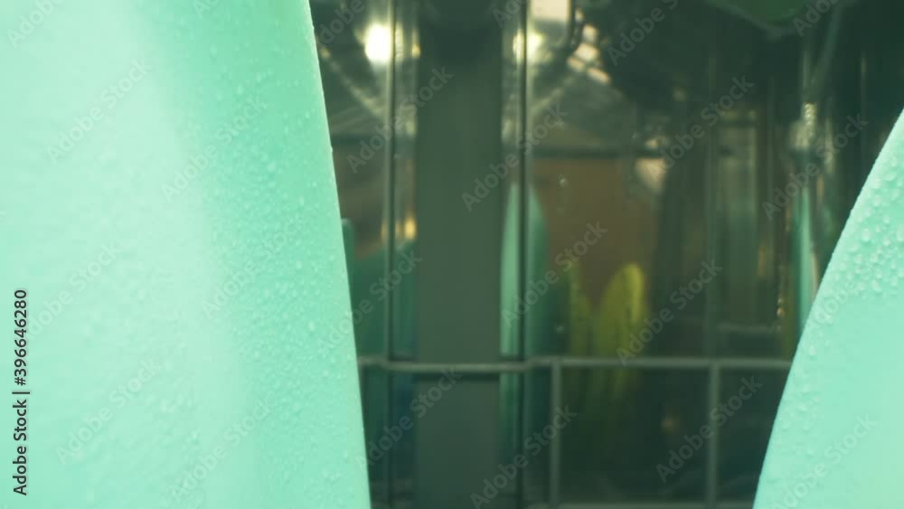 Extreme close-up, detailed point of cookware inside the dishwasher. Extreme close-up, detailed point of cookware inside the dishwasher.