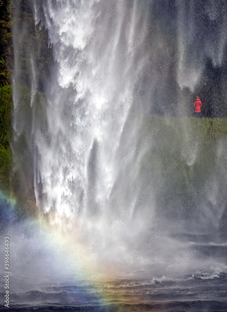 Behind the waterfall in Iceland Behind the waterfall in Iceland