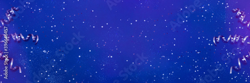 Bright blue banner with sparkles, silver ribbon and confetti of neon colors. Festive backdrop for your projects. Flay lay, top view, copy space