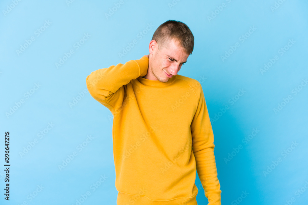 Fototapeta premium Young caucasian handsome man suffering neck pain due to sedentary lifestyle.