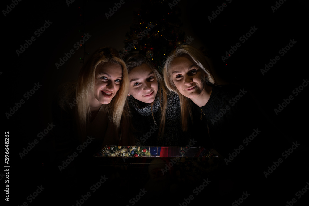 Three sisters looking in the magic box, waiting for miracle Three sisters looking in the magic box, waiting for miracle