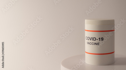 White plastic jar with coronavirus vaccine
