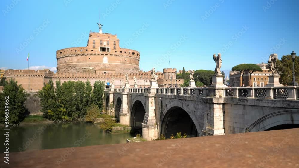 The far away view on the famous roman castle Sant' Angelo from the opposit site of the Tiber river and Angels' Bridge The far away view on the famous roman castle Sant' Angelo from the opposit site of the Tiber river and Angels' Bridge