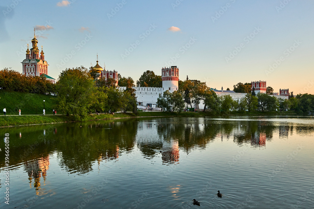 Russia. Moscow. Novodevichy Convent behind the Big Novodevichy Pond after sunset